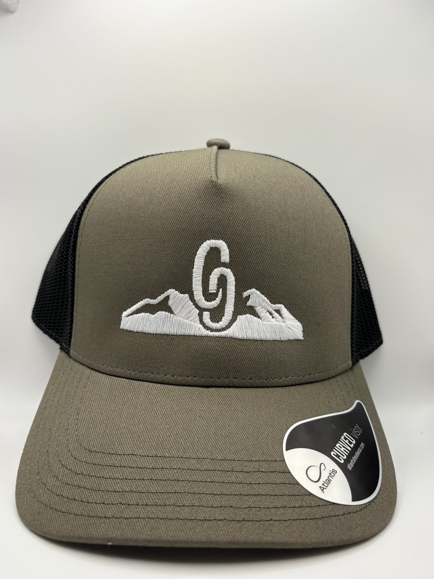 Green cap with white embroidered mountains CG snapback front view