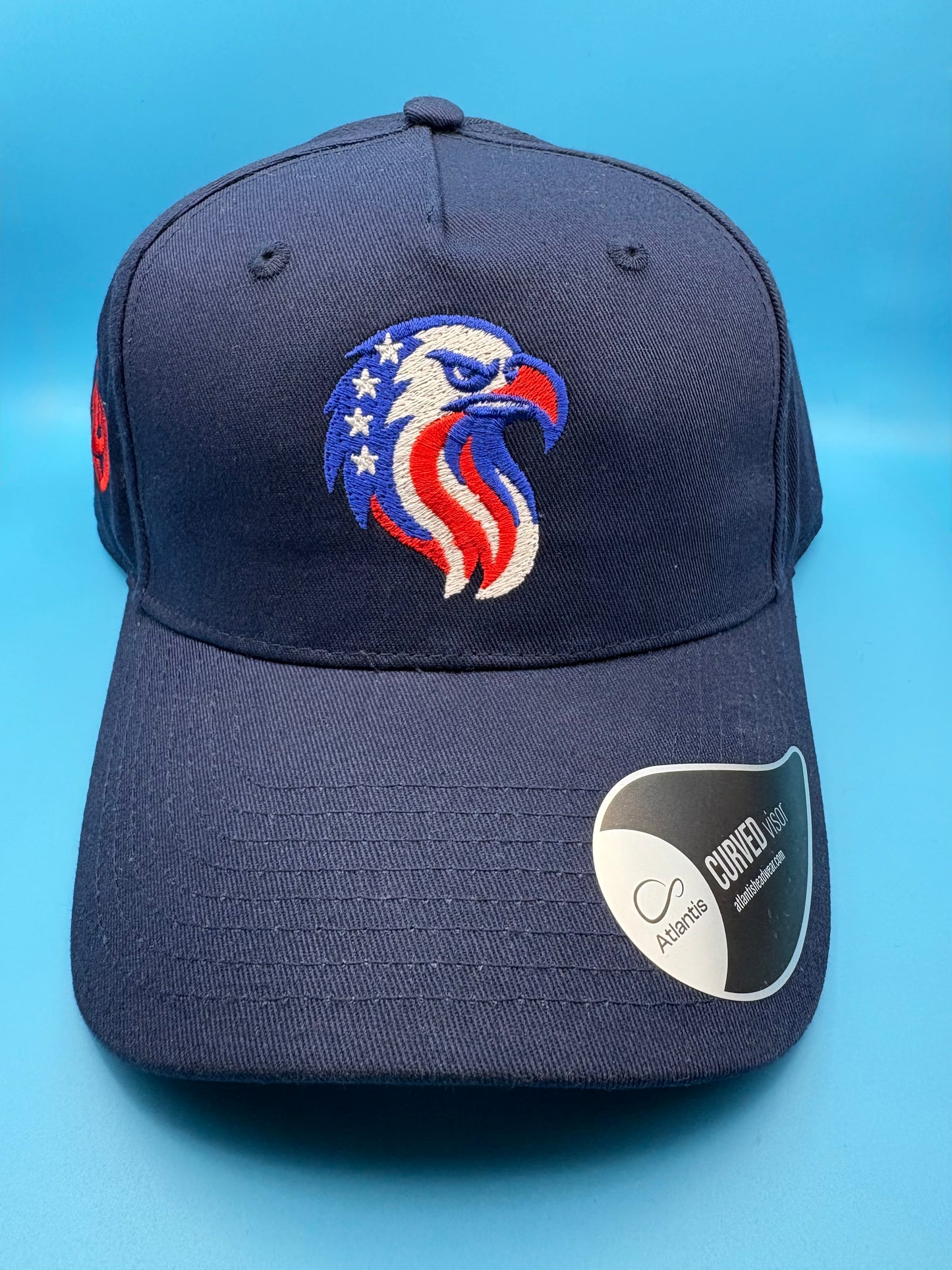 Navy blue cap with an eagle emblem on front