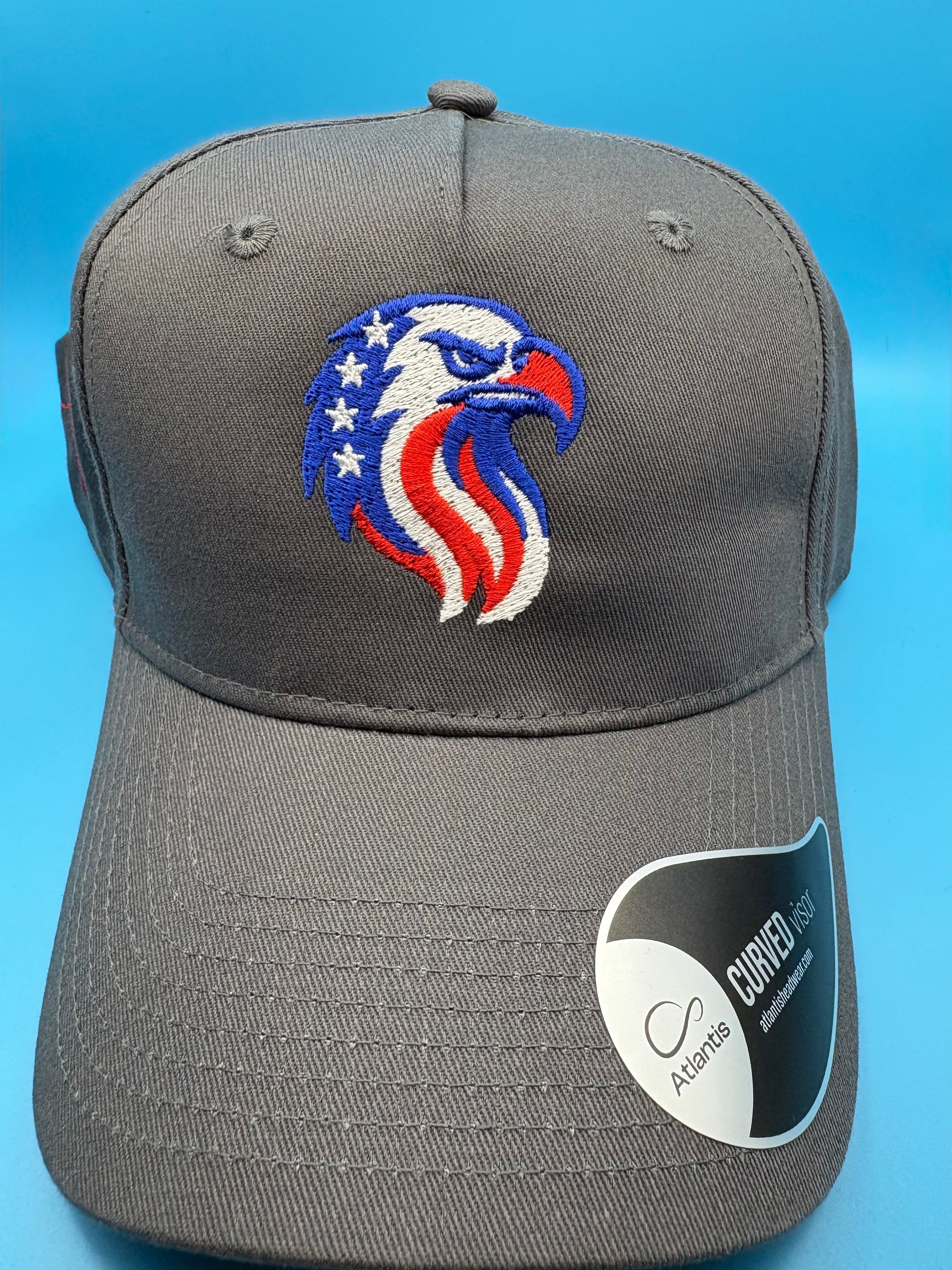 Gray cap with a colorful eagle logo on a blue background front view