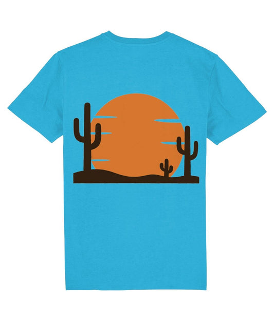 Blue t-shirt with a desert scene graphic featuring cacti and a sunset on a white background